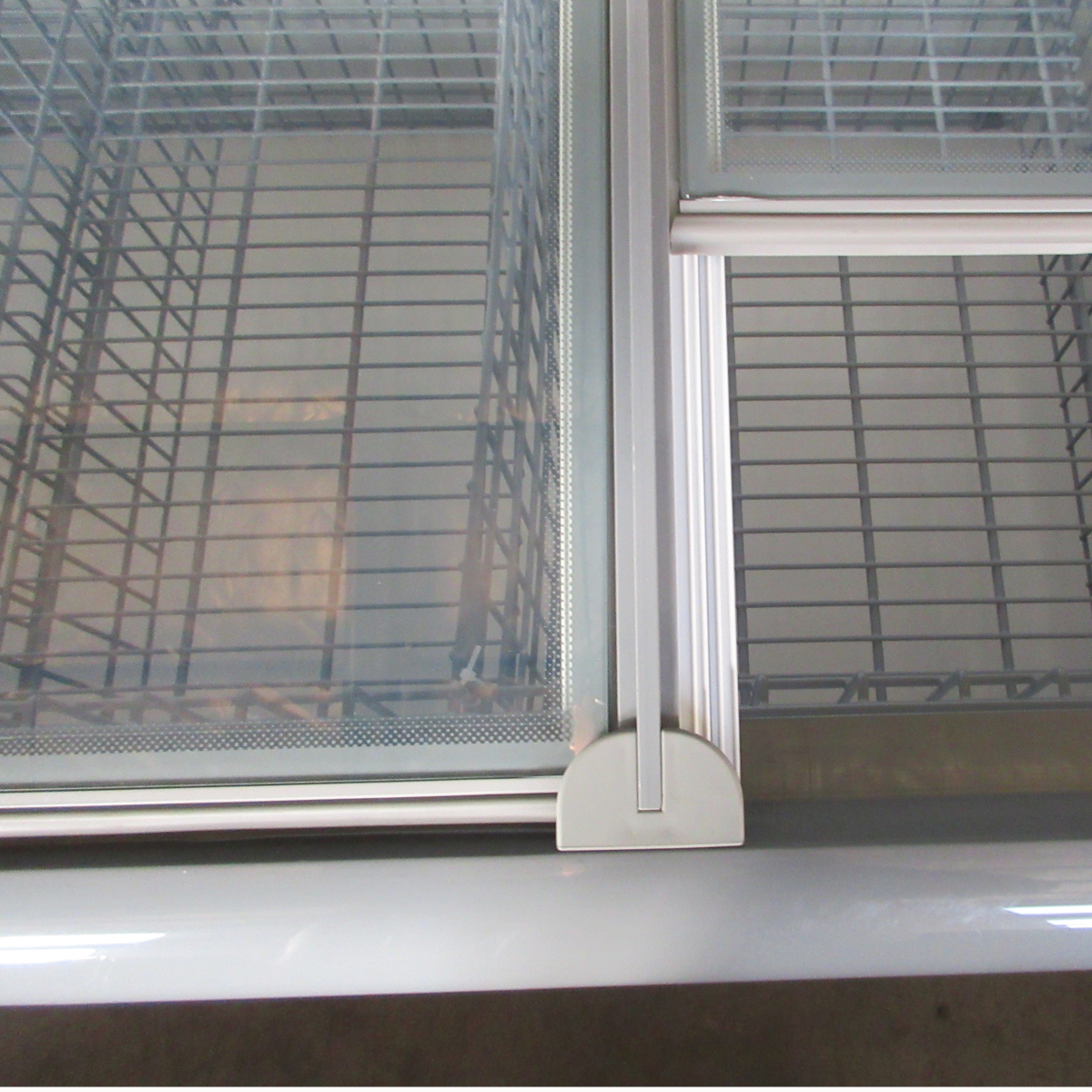 Sliding glass doors on the top of the display cabinet